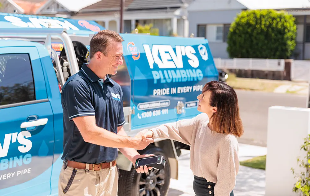 Kev's Plumbing | Technician shake hand and a woman shake hands